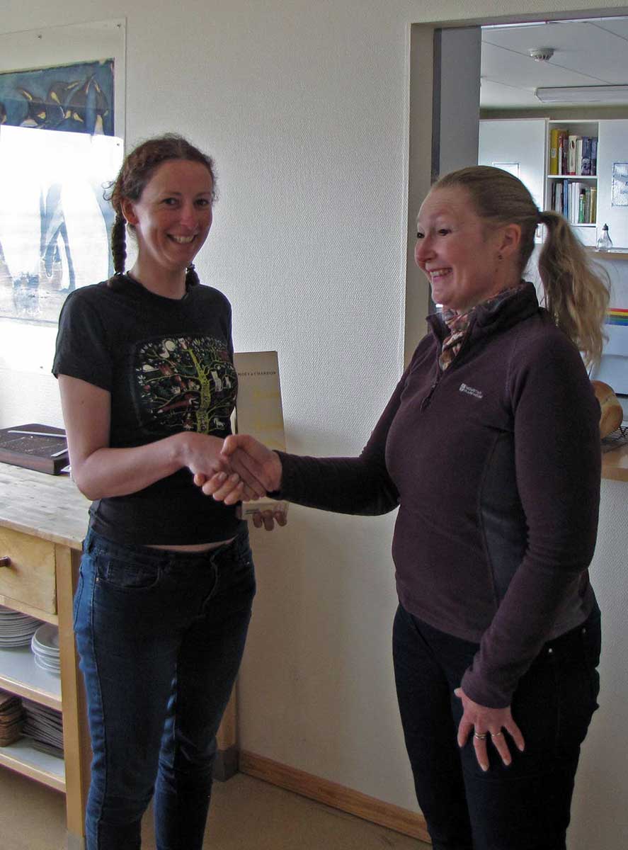 Sarah Lurcock presents Stephanie Winnard (left) with a bottle of champagne for finding the first breeding pipits in the southern area.